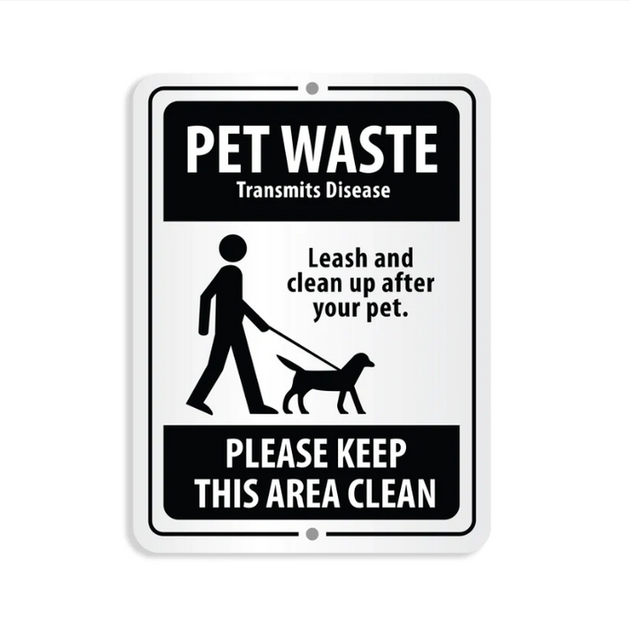 Sign with text about pet waste and leash rules on a white background