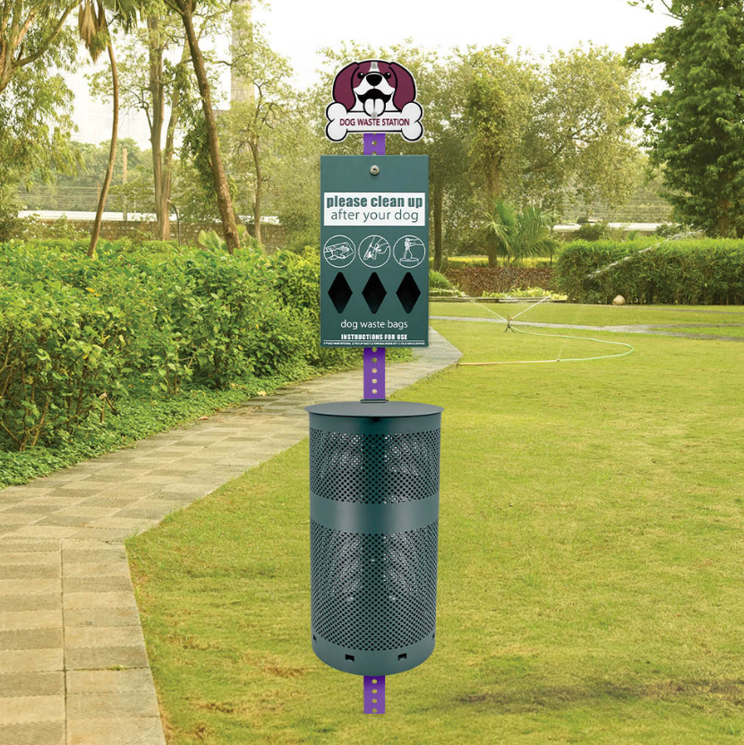 Dog waste disposal station in a park with green grass and trees.
