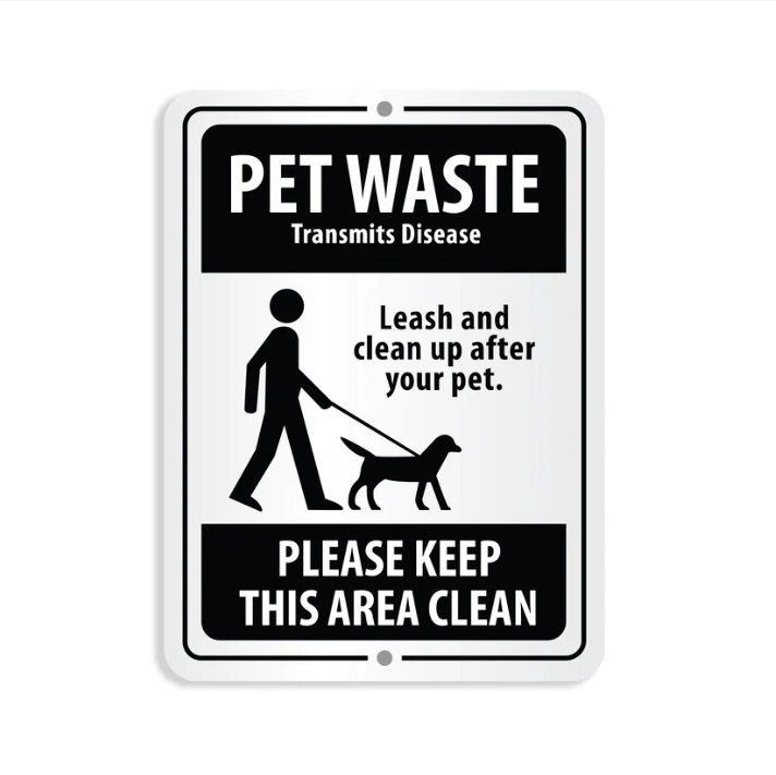 Sign with text about pet waste and leash rules on a white background